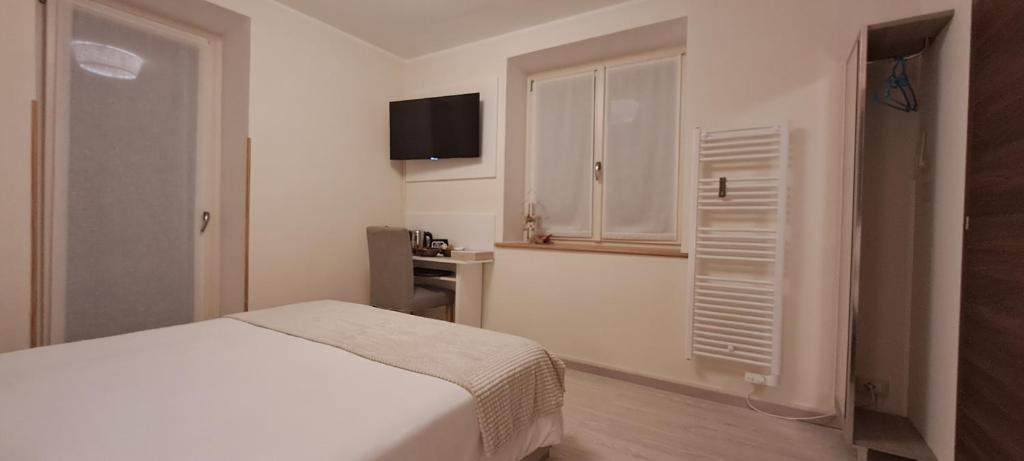 Postel nebo postele na pokoji v ubytování B&B Monastero