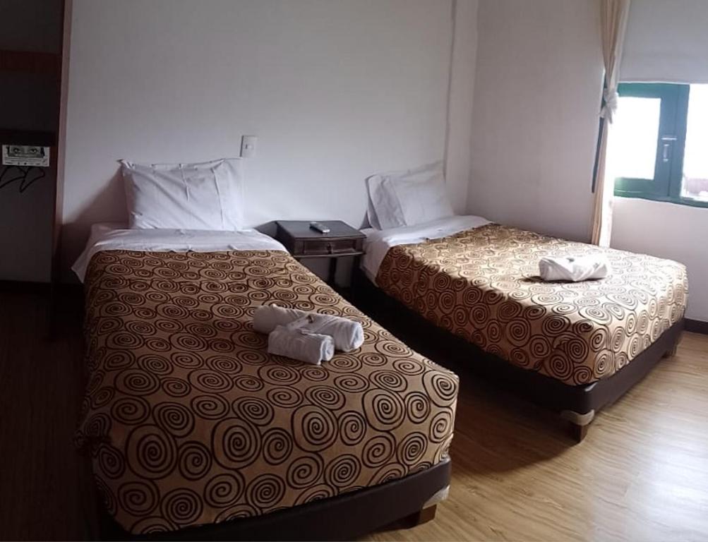 Postel nebo postele na pokoji v ubytování Mongui Plaza Hotel
