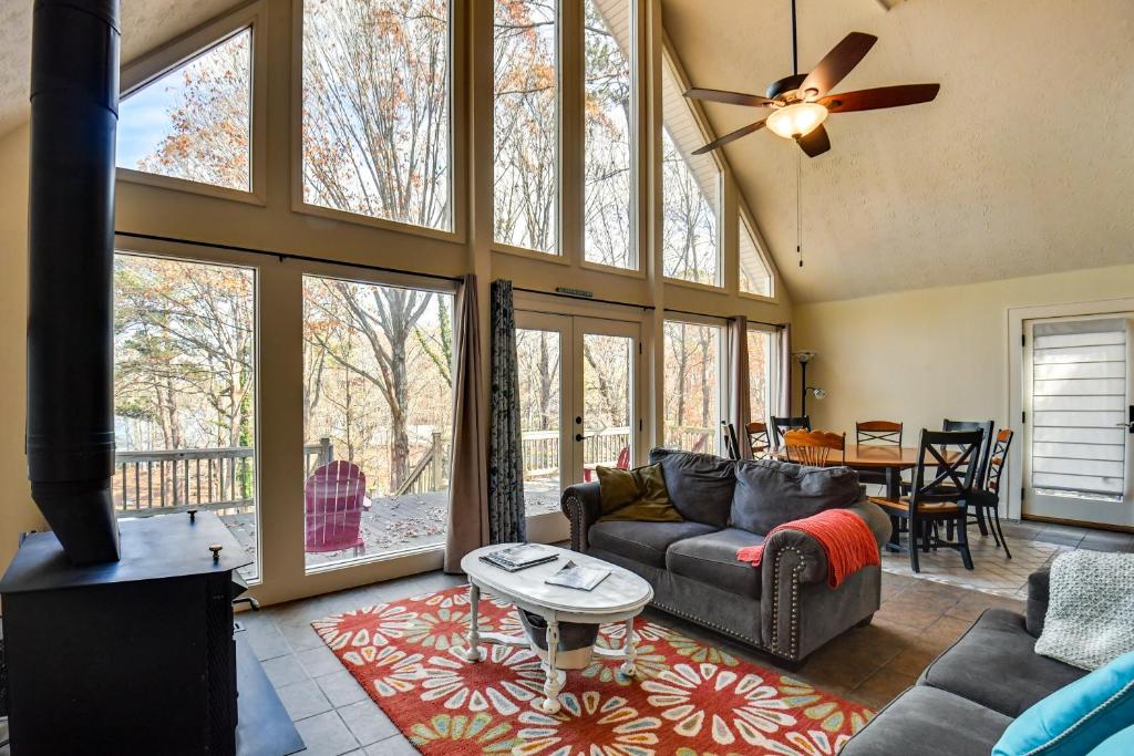 a living room with a couch and a table at Buckhead Home with On-Site Lake Oconee Access! in Eatonton 