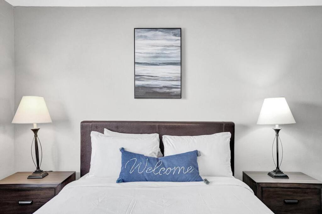 a bedroom with a bed with a blue pillow on it at Pionciana Getaway 1BR Apartment Near FLL Airport in Fort Lauderdale