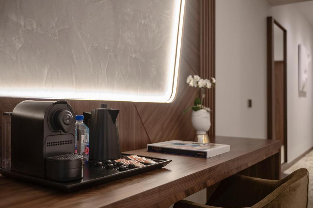 Hotel Via Venetoにあるコーヒーまたはお茶