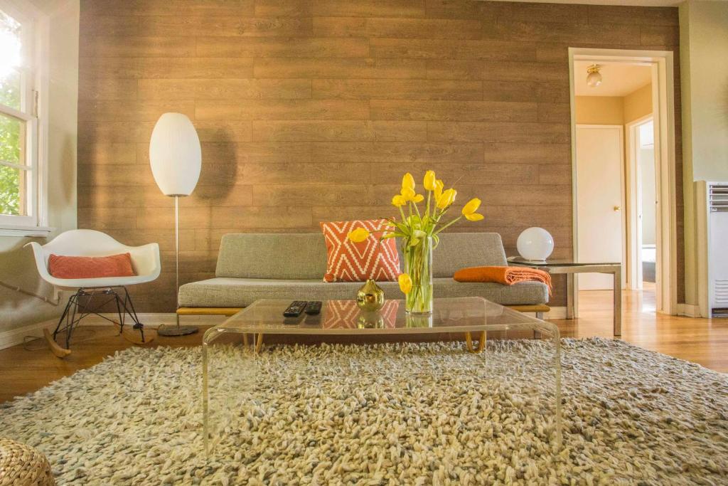 a living room with a couch and a table at The Venice Beachwood in Los Angeles
