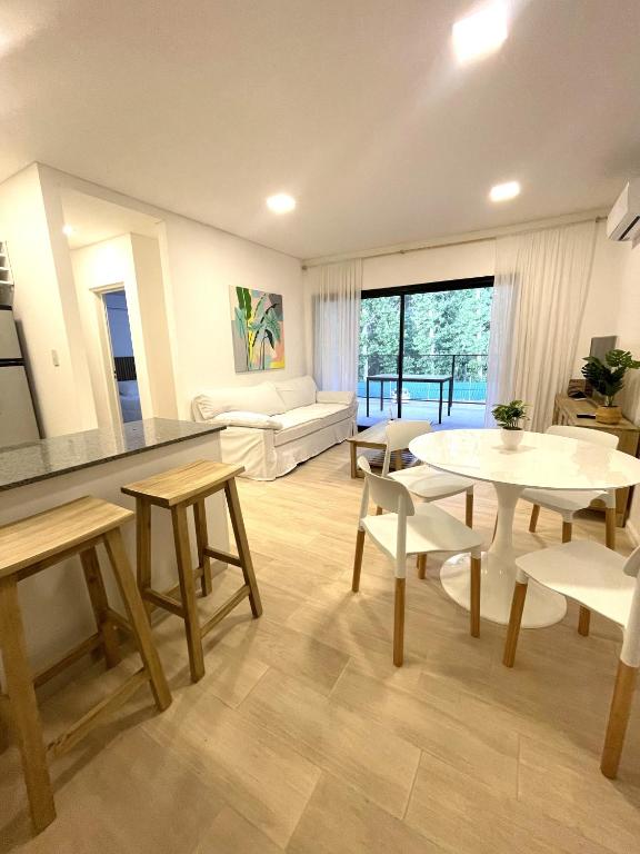 a living room with a table and chairs at Altos de la Cañada in Pilar