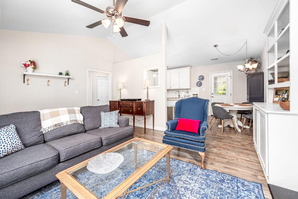 a living room with a couch and a table at Cozy Pet friendly home-Raleigh in Raleigh