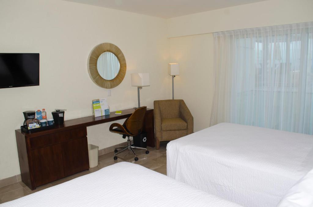 Postel nebo postele na pokoji v ubytování Four Points by Sheraton Veracruz