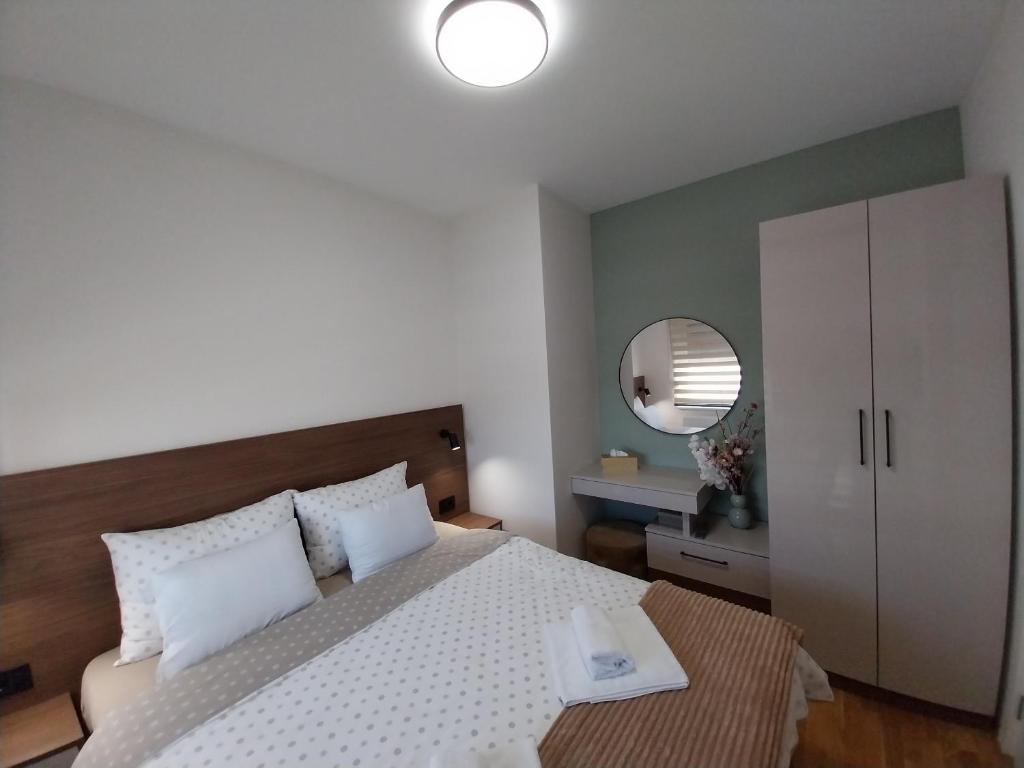 Postel nebo postele na pokoji v ubytování Lider Lux Apartman