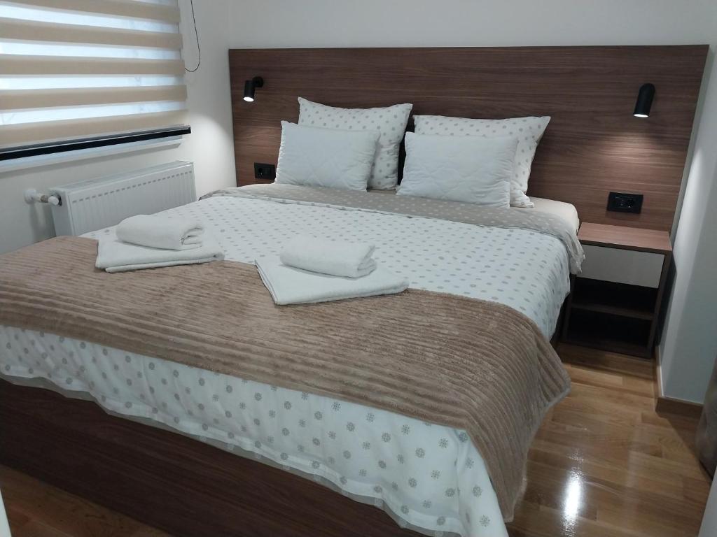 Postel nebo postele na pokoji v ubytování Lider Lux Apartman
