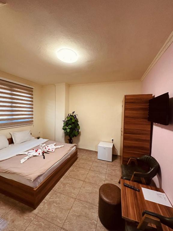 Postel nebo postele na pokoji v ubytování Hotel Atika