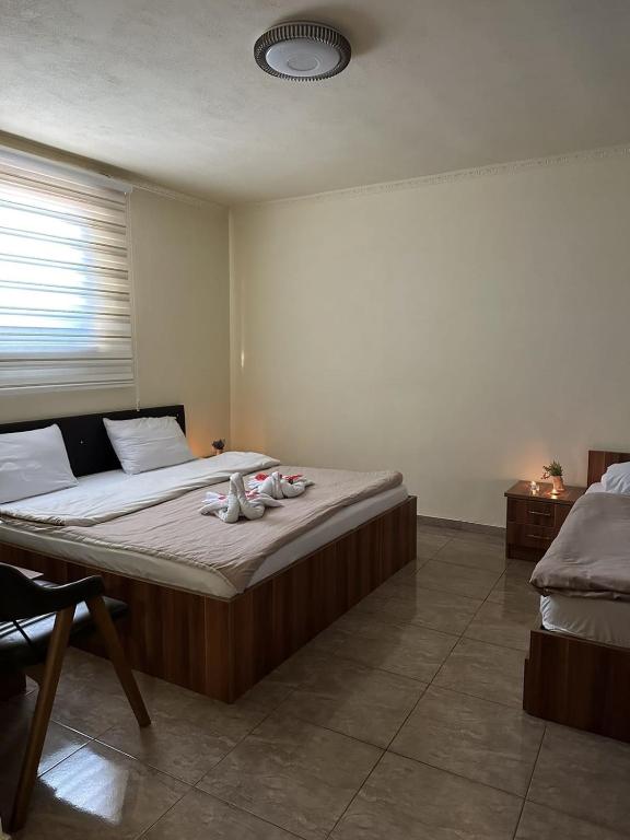 Postel nebo postele na pokoji v ubytování Hotel Atika