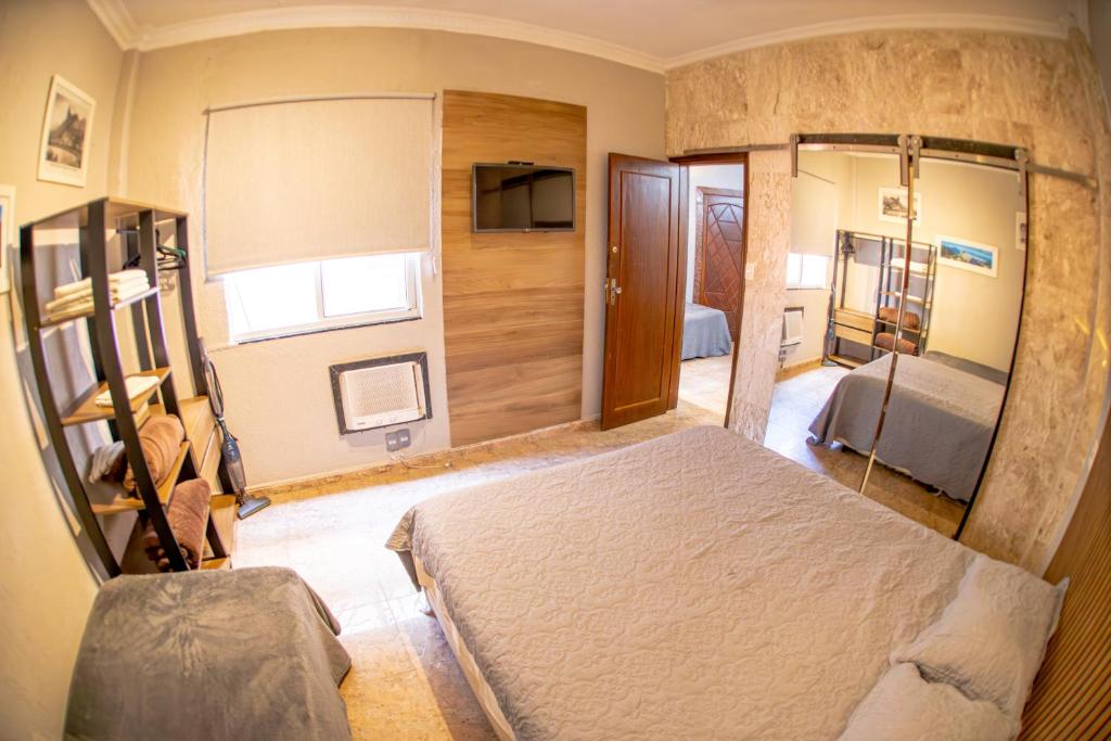 a bedroom with a large bed in a room at Ipanema Vinicius de Moraes II in Rio de Janeiro