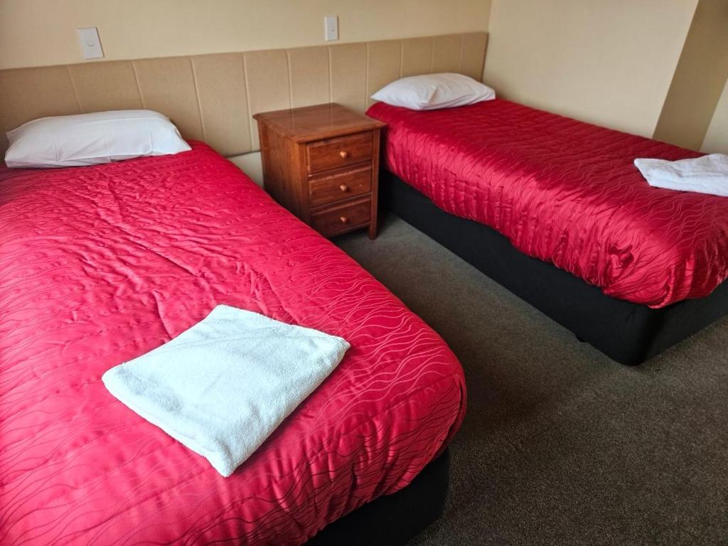 Postel nebo postele na pokoji v ubytování Kiwi Park Motels