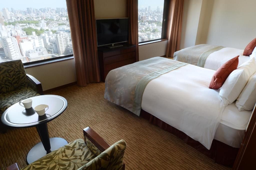 Postel nebo postele na pokoji v ubytování Hotel Metropolitan Tokyo Ikebukuro