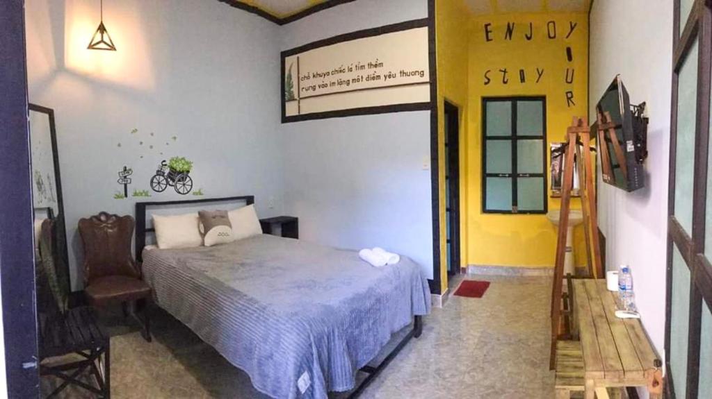 Postel nebo postele na pokoji v ubytování Homestay Vườn nhãn