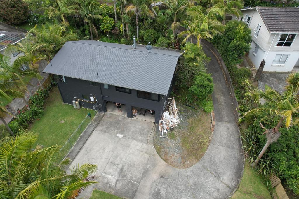 an aerial view of a house with a gray roof at Huriana Place in Kaitaia