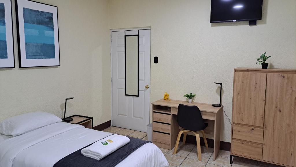 Casa Colibrí Apartamento 2A tesisinde bir odada yatak veya yataklar