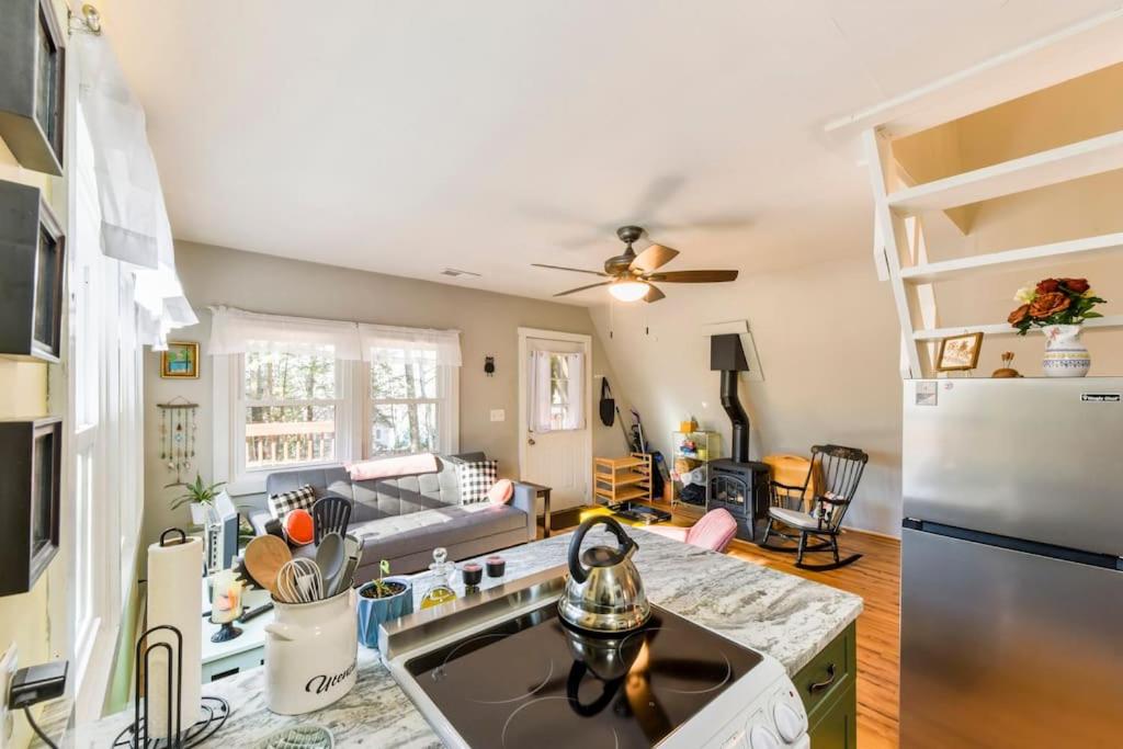 a kitchen and living room with a refrigerator at All Points' End in Naples