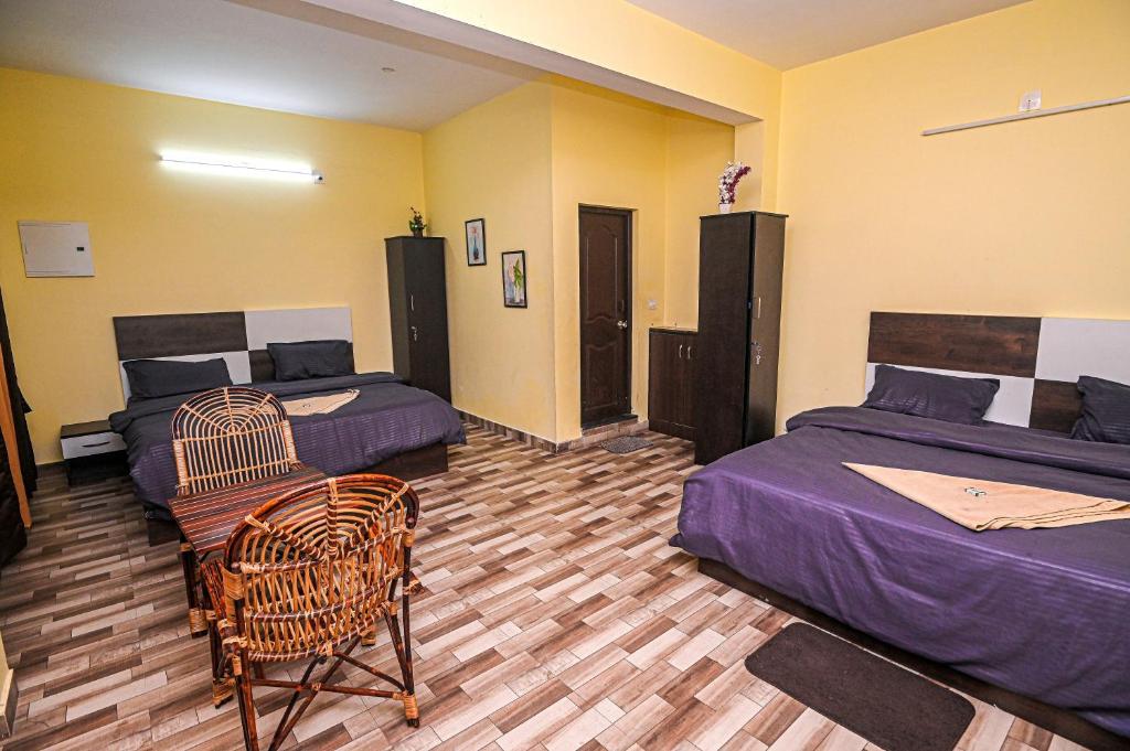 Postel nebo postele na pokoji v ubytování Jeru Homes