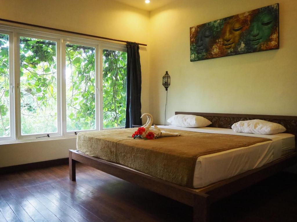 Postel nebo postele na pokoji v ubytování De'dalam two storey