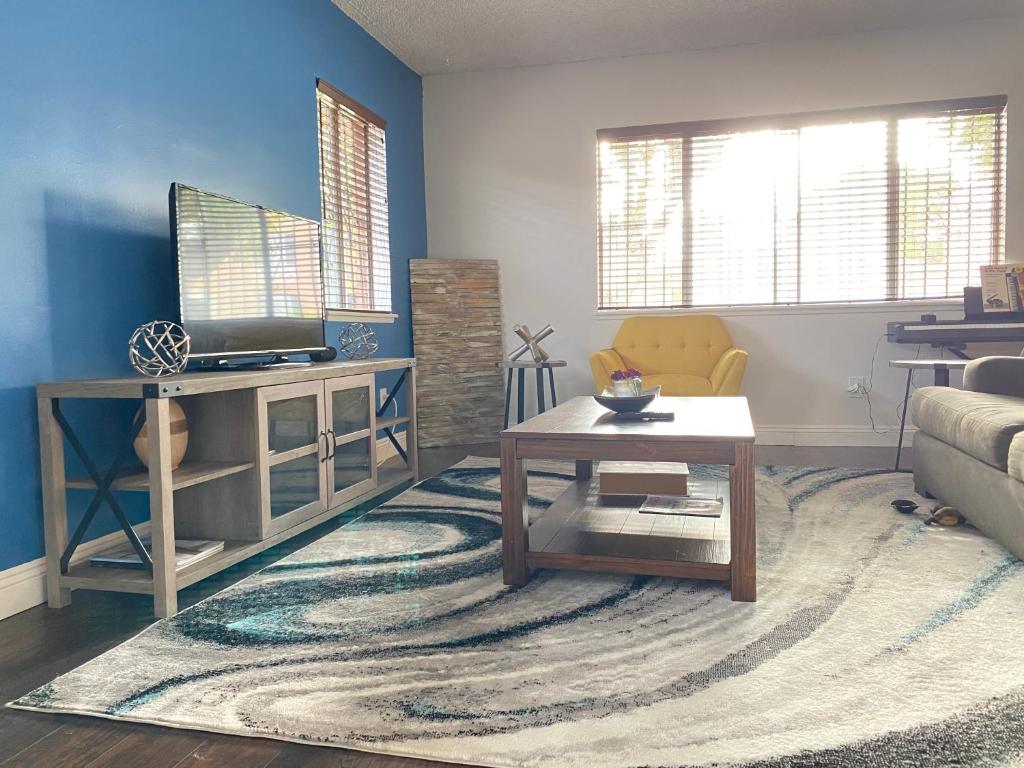 a living room with a couch and a table at Modern Stay - Private Room in Long Beach