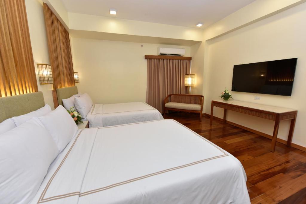 Kabayan Hotel Pasayにあるベッド