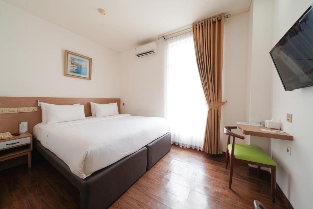 Postel nebo postele na pokoji v ubytování Heef Hotel