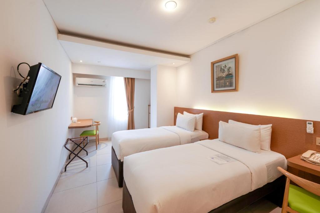 TV a/nebo společenská místnost v ubytování Heef Hotel