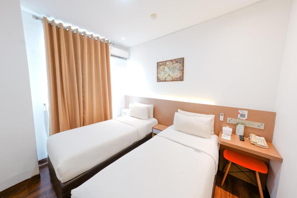Postel nebo postele na pokoji v ubytování Heef Hotel