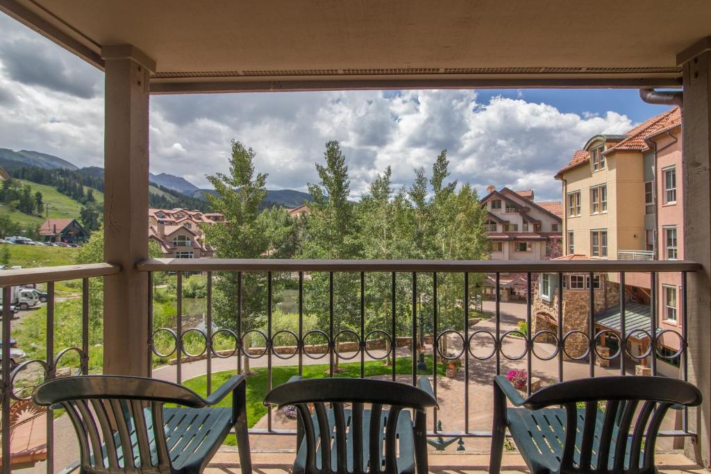a view from the balcony of a house with chairs at Westermere 311 - 2 by AvantStay Just Steps From Ski Area w Great Views in Telluride