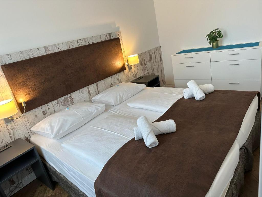 Postel nebo postele na pokoji v ubytování Versava Apartments