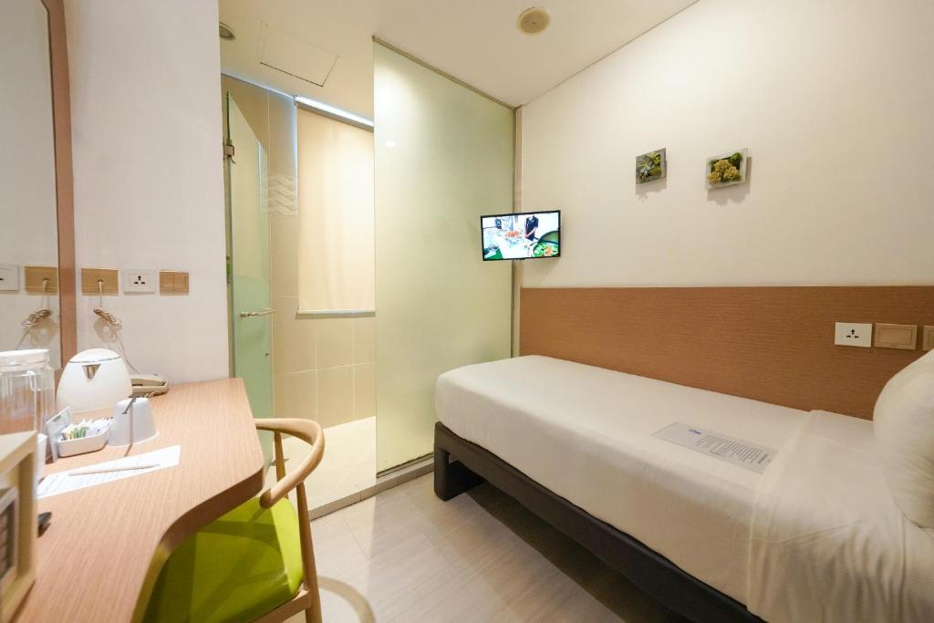 Postel nebo postele na pokoji v ubytování Heef Hotel