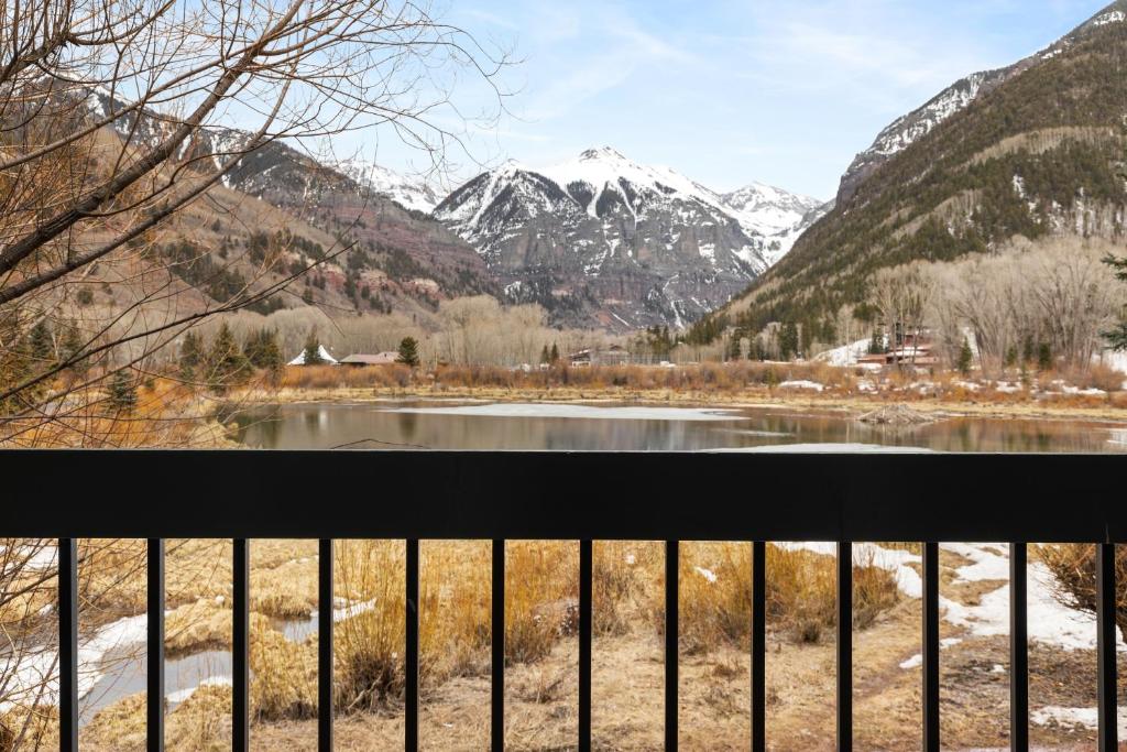 a view from a balcony of a river and mountains at Riverside Condos B101 by AvantStay Condo Close To Downtown Town Park Ski Lift 8 in Telluride