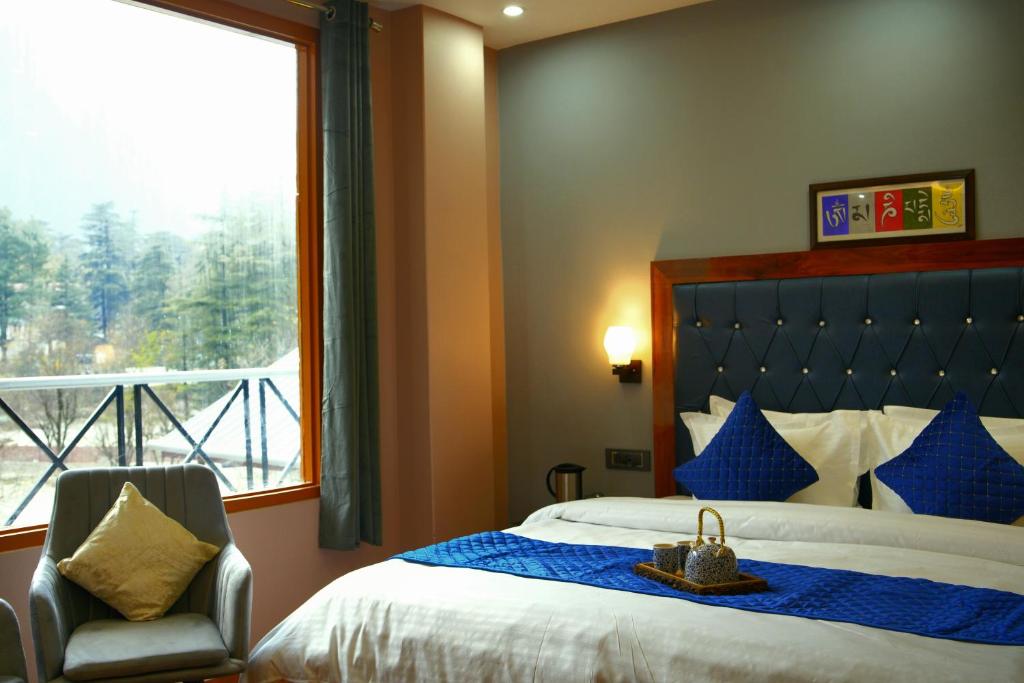 Tempat tidur dalam kamar di Kasol ArtHouse - The Treasure of Himalayas