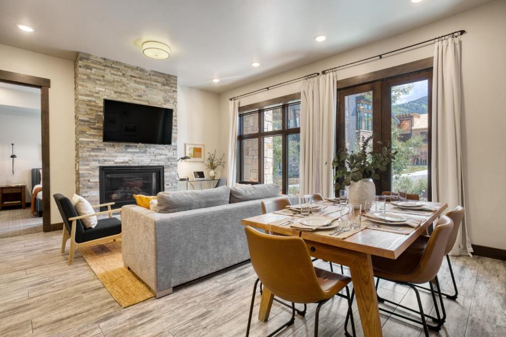 a living room with a table and a couch at Chicane by AvantStay Close to the Ski Slopes in this Majestic Home in Park City in Park City