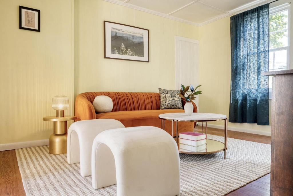 a living room with a couch and a table at Eloise by AvantStay Historic Upstate Apartment near Hudson River in Saugerties