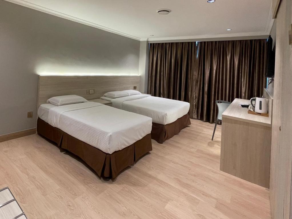 Postel nebo postele na pokoji v ubytování Hotel Imperial