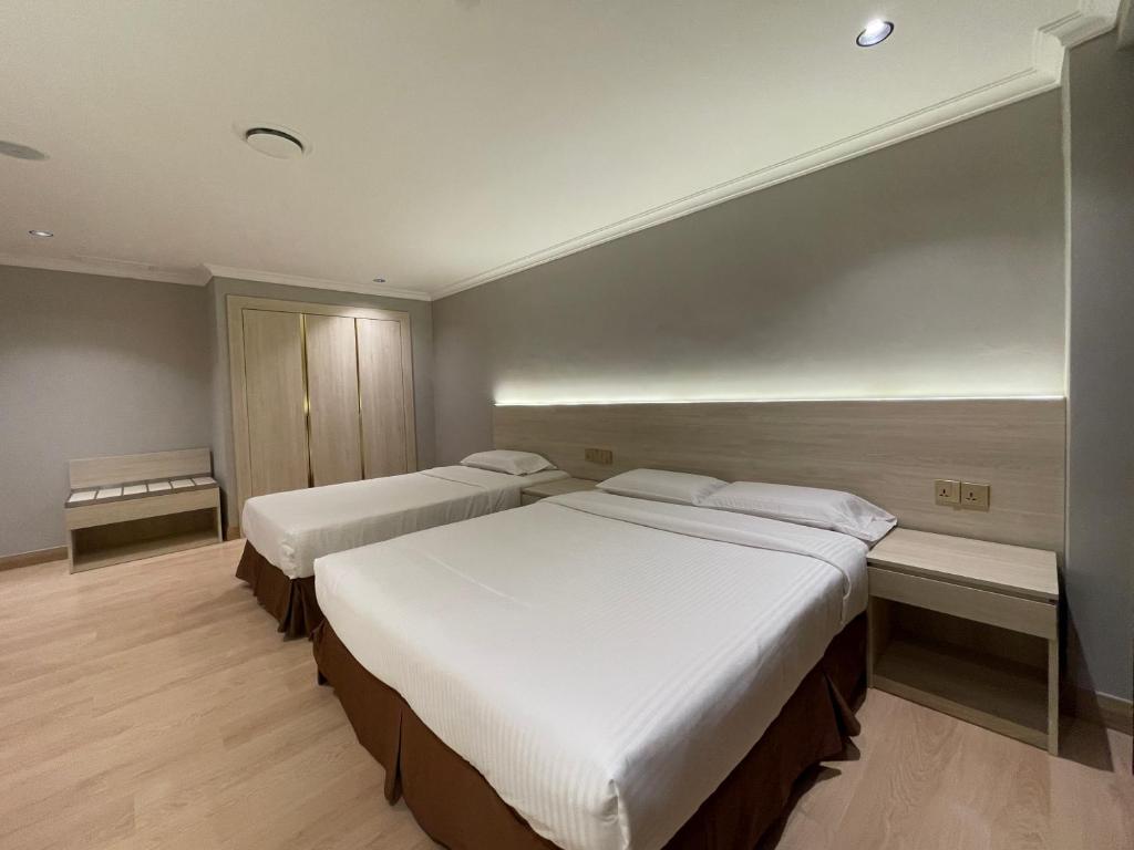 Postel nebo postele na pokoji v ubytování Hotel Imperial
