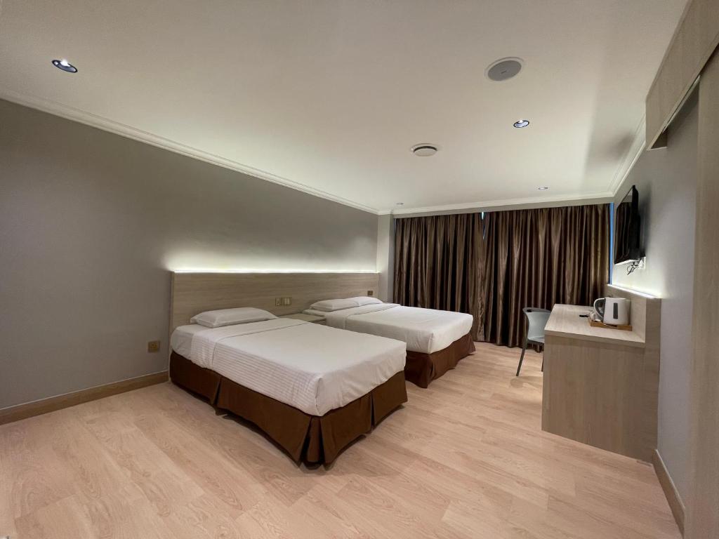 Postel nebo postele na pokoji v ubytování Hotel Imperial