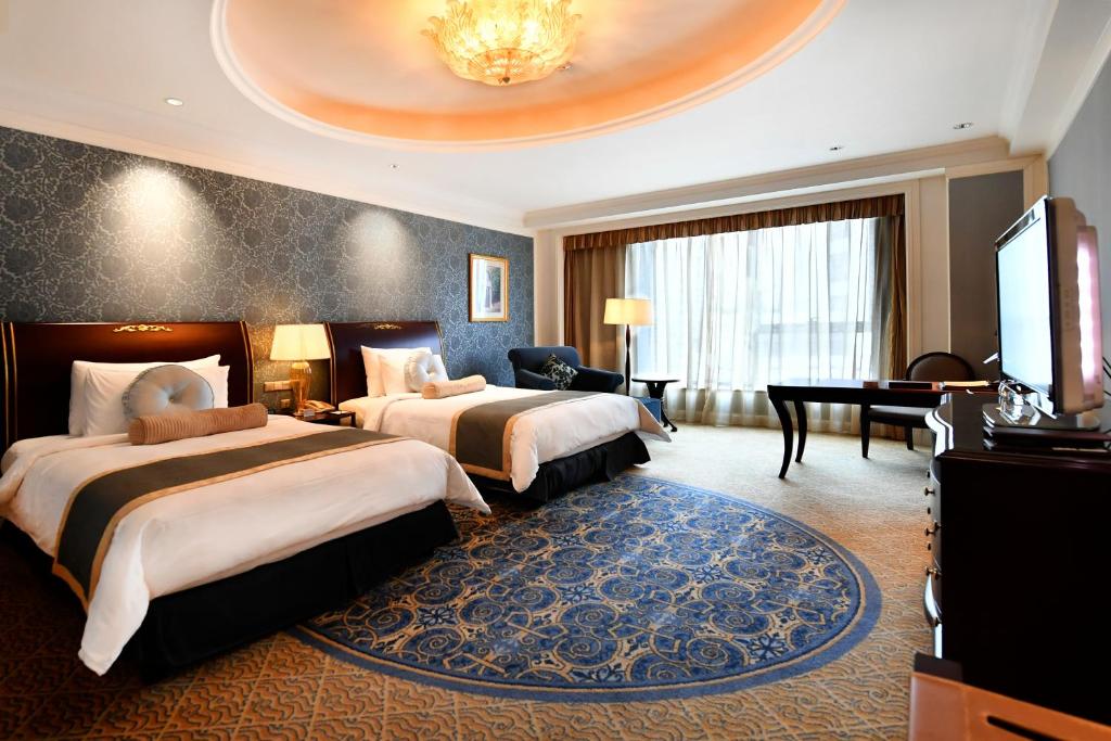 Postel nebo postele na pokoji v ubytování Grand Central Hotel Shanghai - Nanjing Road