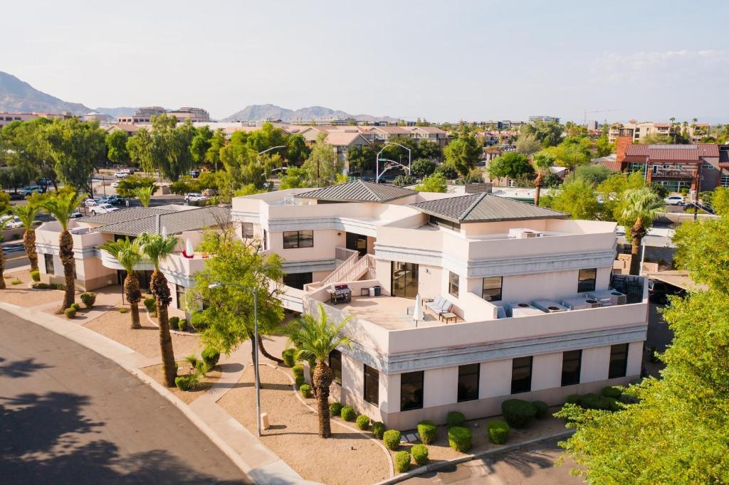 an aerial view of a white house with palm trees at Ivory Buyout By AvantStay Two Home Buyout Near Old Town w Large Patio in Scottsdale