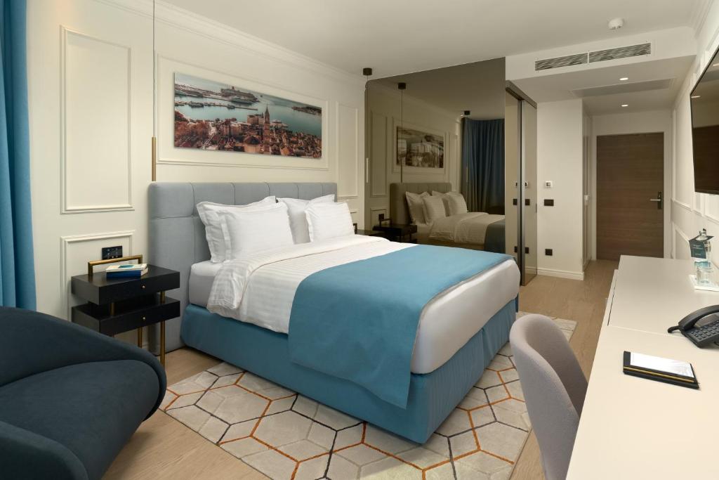 Postel nebo postele na pokoji v ubytování Mirari Boutique Hotel