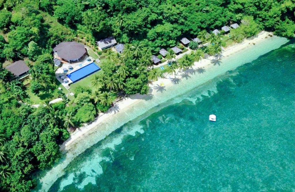 an aerial view of a resort on a beach at Tuburan Cove Beach Resort in Buruanga