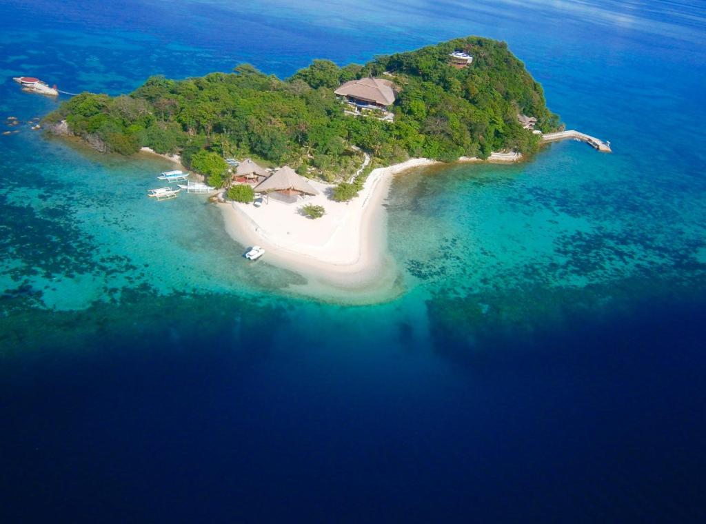 an aerial view of an island in the ocean at NoaNoa Private Island in Taytay