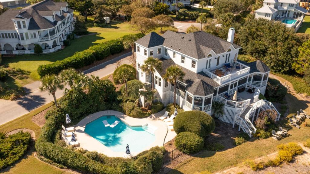 an aerial view of a large white house with a swimming pool at Haven by AvantStay Luxury Beachfront Home w Pool Gorgeous Patios in Sullivans Island