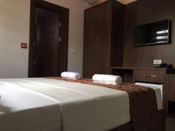 Postel nebo postele na pokoji v ubytování AEN Hotel-Old City