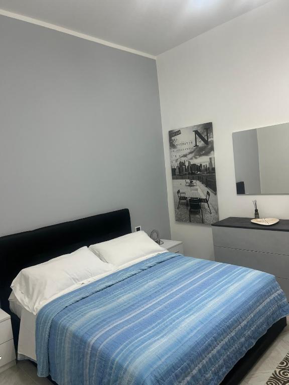 Uma cama ou camas num quarto em Camere Andrea
