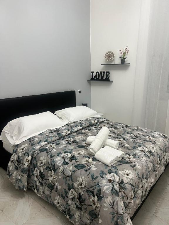 Uma cama ou camas num quarto em Camere Andrea