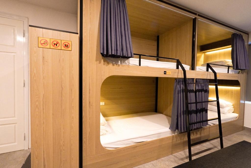 Postel nebo postele na pokoji v ubytování MOTOGO Hostel