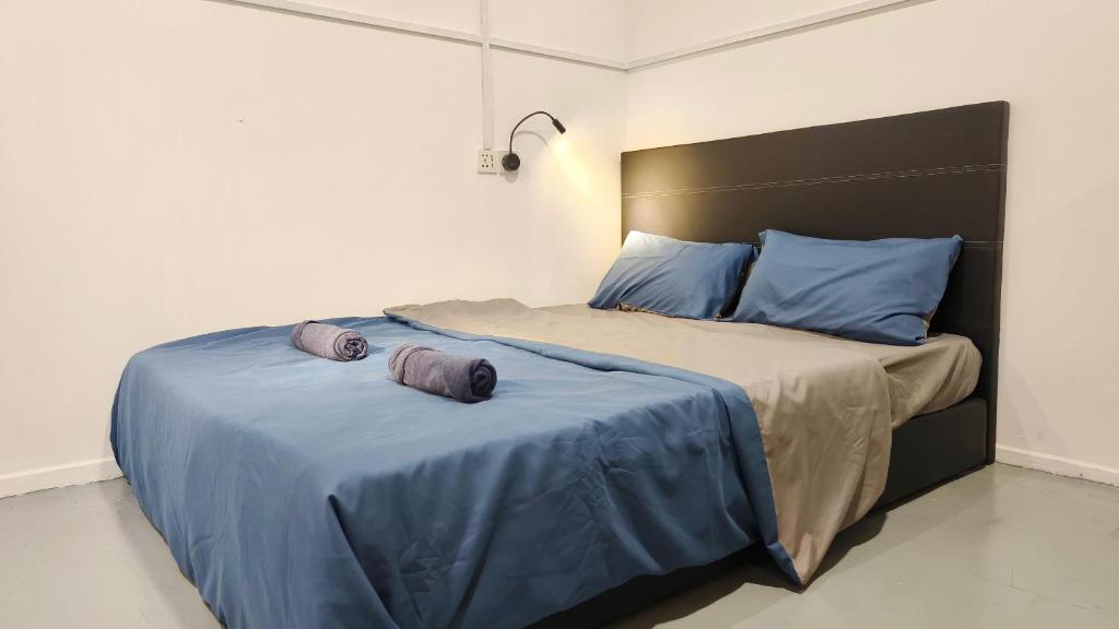 Postel nebo postele na pokoji v ubytování Warisan Homestay 18pax Kota Kinabalu
