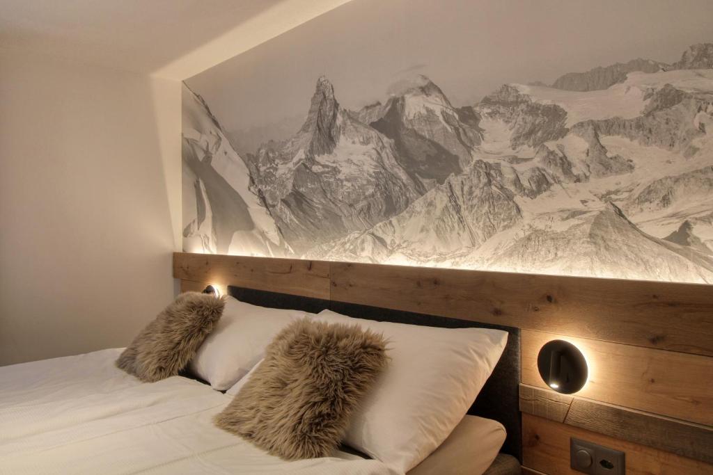Postel nebo postele na pokoji v ubytování Matterhorngruss Apartments