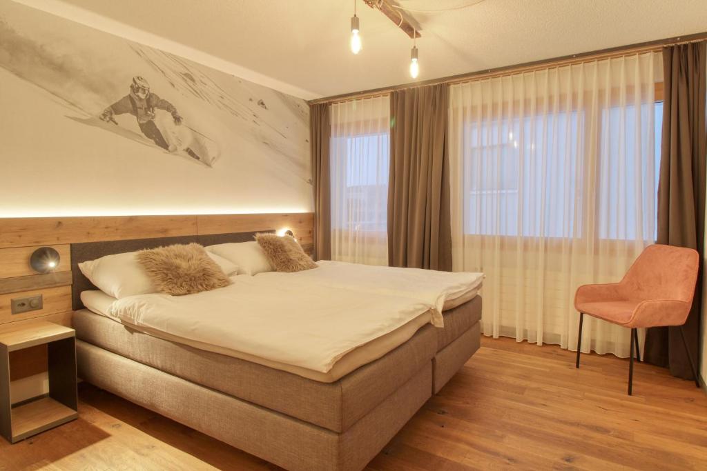 Postel nebo postele na pokoji v ubytování Matterhorngruss Apartments